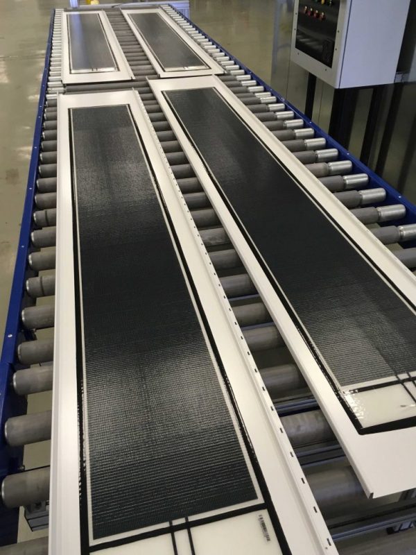 CIGS thin-film BIPV solar panels integrated into modern building architecture